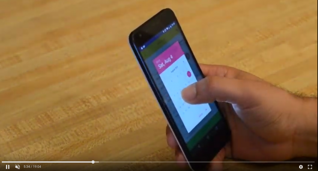 Video screenshot of conducting in-person mobile usability testing.
